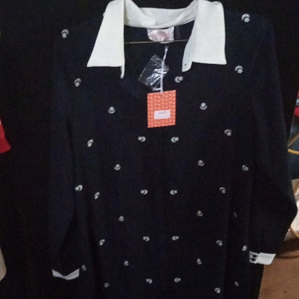 This is a brand new sleek White collar navy blue with white moon and stars.